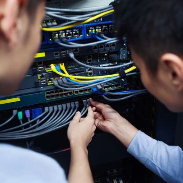 IT technicians working on server rack